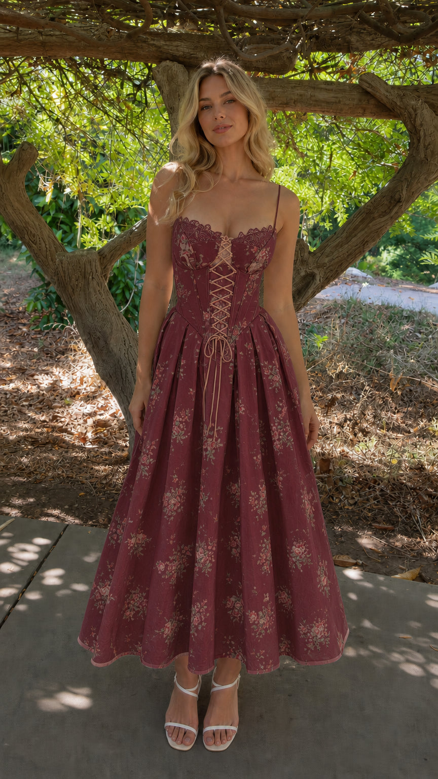 Woman wearing burgundy floral corset midi dress