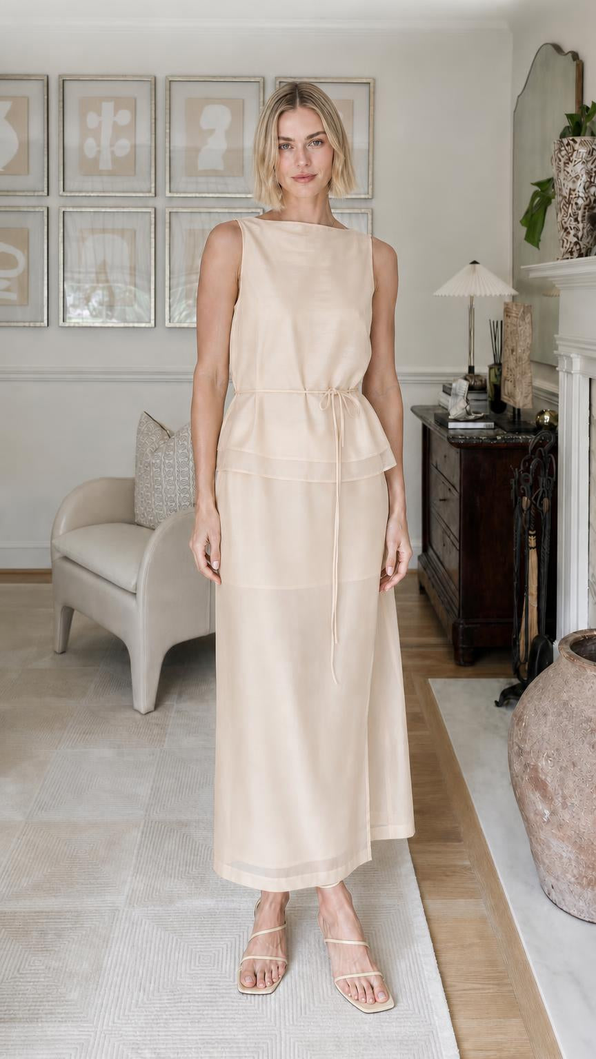 Woman wearing beige sleeveless tiered maxi dress