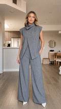 Front view of model wearing grey pinstripe high-neck top and wide-leg pants set
