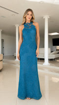 Front view of model wearing blue embroidered halter maxi dress