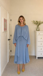 Front view of model wearing light blue long-sleeve pleated midi dress