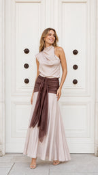Front view of model wearing champagne and brown draped maxi dress