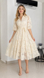 Front view of cream floral embroidered midi dress with belt