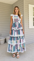 Full front view of model wearing multi patchwork tiered maxi dress
