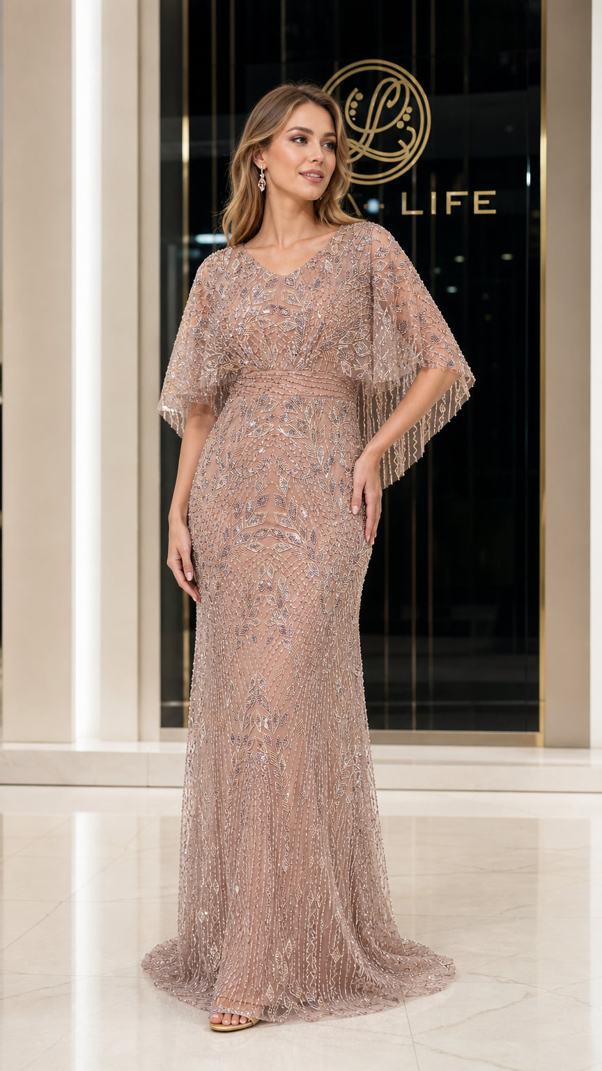 Front view of woman wearing champagne beaded floor-length evening gown