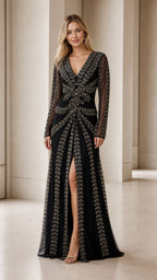 Model wearing black beaded long sleeve evening gown front view