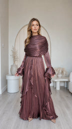Front view of model wearing metallic brown pleated long sleeve maxi dress