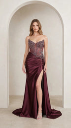 Model wearing burgundy sequin corset satin evening gown front view