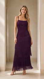 Front view of model wearing the purple fringe sequin maxi dress