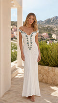 Front view of woman wearing white off-shoulder embellished long evening dress