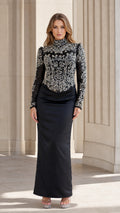 Front view of black embellished evening gown