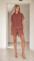 Front view of Dusty Rose lace trimmed tiered short set on model