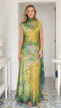 Model wearing yellow printed cowl neck maxi dress, front view