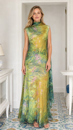 Model wearing yellow printed cowl neck maxi dress, front view