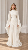 Front view of Ivory ruched high-neck maxi dress with dramatic cape sleeves