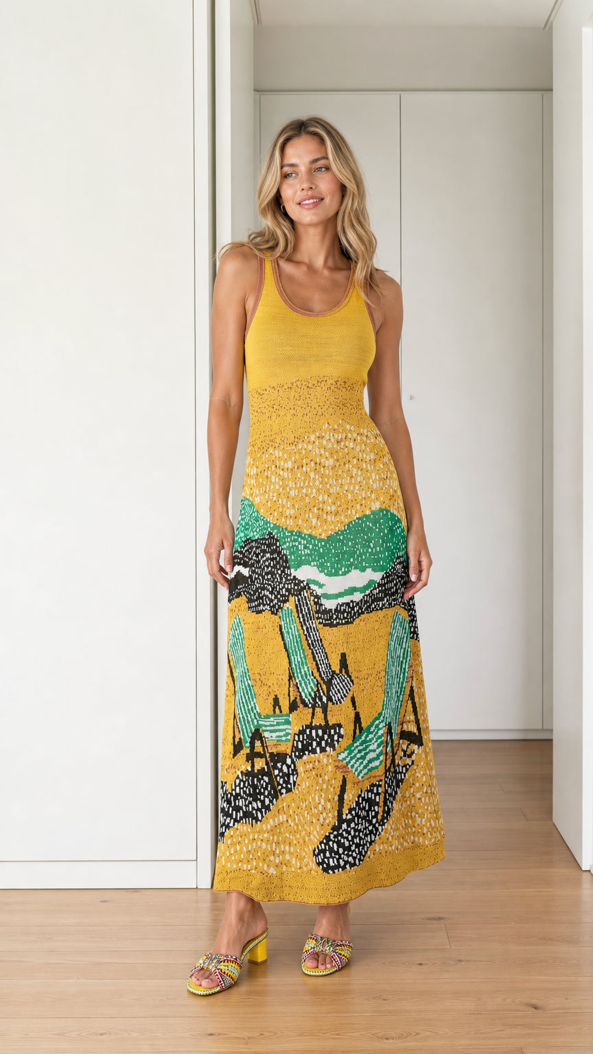 Front view of yellow landscape knit maxi dress