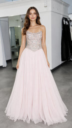 Front view of model wearing pink embellished strapless formal gown