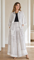 Front view of model wearing white geometric print two-piece set