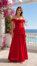 Front view of woman wearing red off-shoulder corset maxi dress