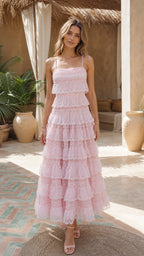 Front view of model wearing pink tiered lace maxi dress