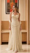 Front view of model wearing the champagne halter lace maxi dress with matching wrap