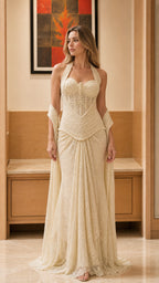 Front view of model wearing the champagne halter lace maxi dress with matching wrap