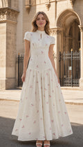 Front view of ivory floral embroidered maxi dress on model