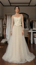 Front view of champagne beaded corset tulle evening gown