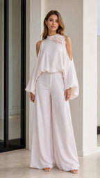 Front view of elegant white cold-shoulder blouse and wide-leg pants set