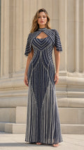 Model wearing navy beaded capelet evening gown front view