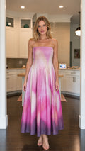 Front view of model wearing pink ombre smocked maxi dress