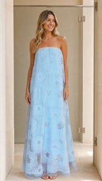 Model wearing light blue strapless sequin floral maxi dress front view