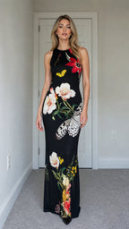Model wearing black floral butterfly print sleeveless maxi dress from the front