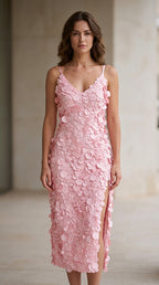 Front view of model wearing pink 3D petal applique midi dress