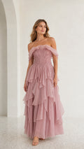 Front view of model wearing mauve off-shoulder tiered maxi dress