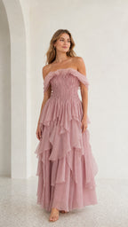 Front view of model wearing mauve off-shoulder tiered maxi dress