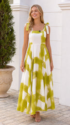 Front view of woman wearing white and green brushstroke maxi dress
