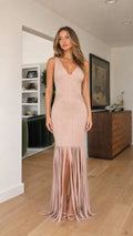 Front view of model wearing blush sleeveless ribbed fringe maxi dress