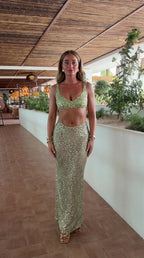 Front view of model wearing sage green sequin two-piece set