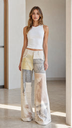 Front view of model wearing white patchwork wide leg jeans