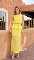 Front view of model wearing a yellow sleeveless layered maxi dress
