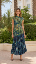 Front view of green butterfly print maxi dress on model