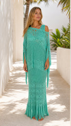 Model wearing teal boho crochet fringe two-piece maxi set, front view
