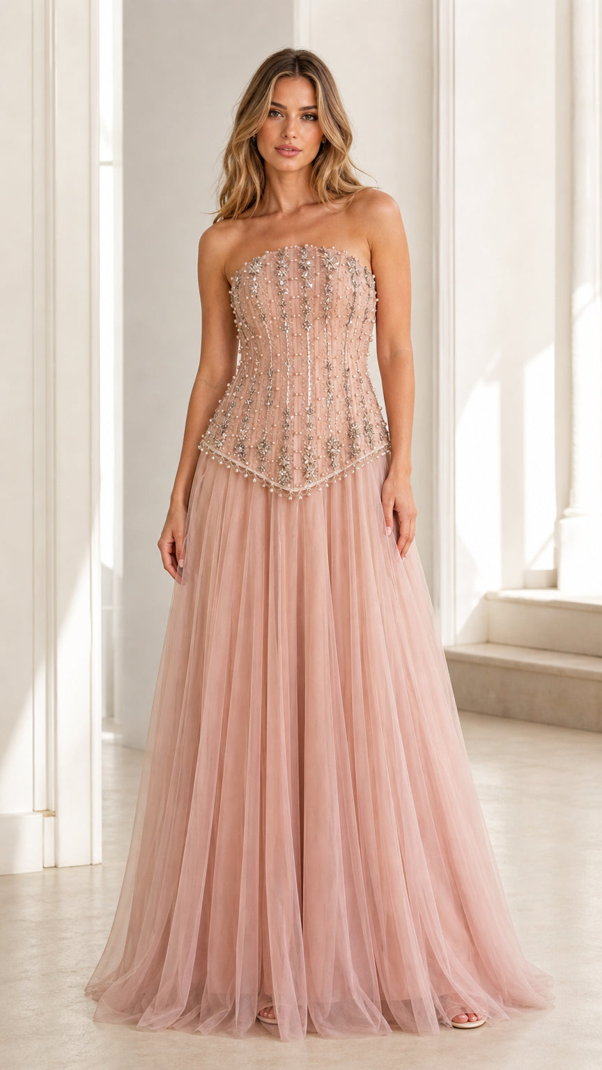 Front view of pink embellished strapless tulle evening gown