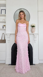 Front view of model wearing pink strapless floral applique maxi dress