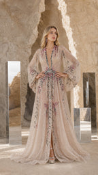 Front view of Champagne embroidered beaded long sleeve evening gown