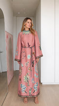 Model wearing pink boho printed long sleeve maxi dress, front view