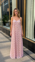 Front view of model wearing pink floral applique maxi dress