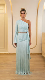 Front view of light blue one-shoulder crop top and fringe maxi skirt set