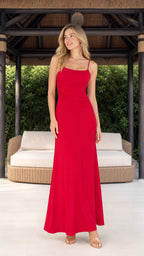 Model wearing red ruched spaghetti strap maxi dress from the front